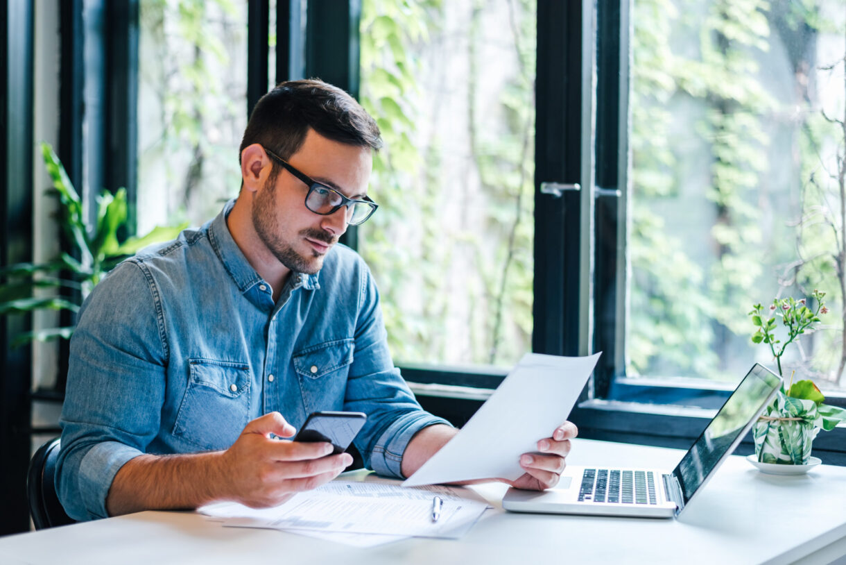 man looking at year end marketing strategies