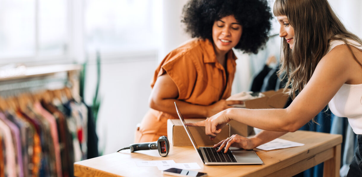 woman looking at partner's funding position and creating business website